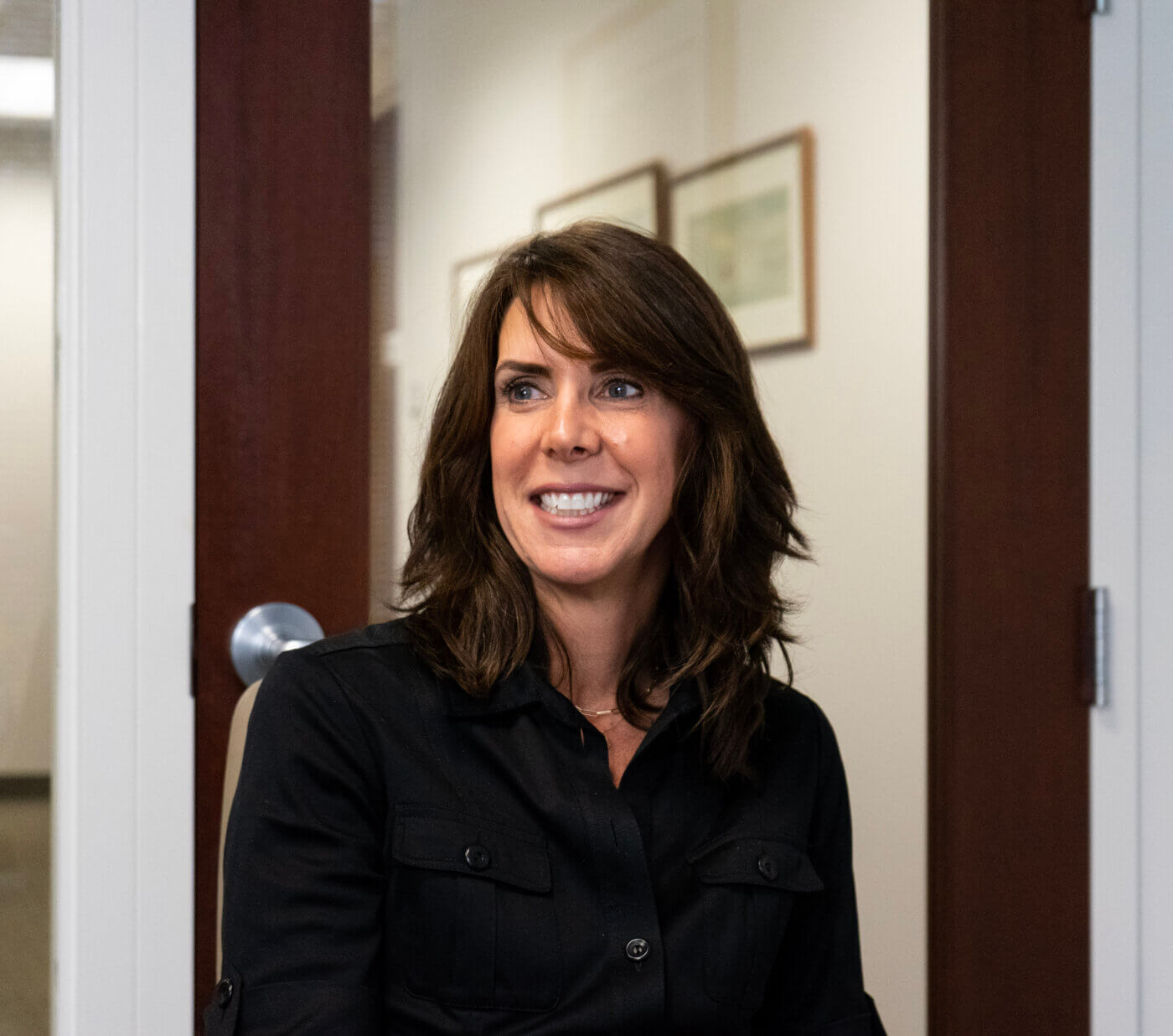 1 female Yates employee smiling.