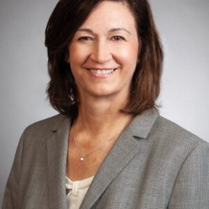 Headshot of Christy Kovac, President/CEO, Sheridan Construction
